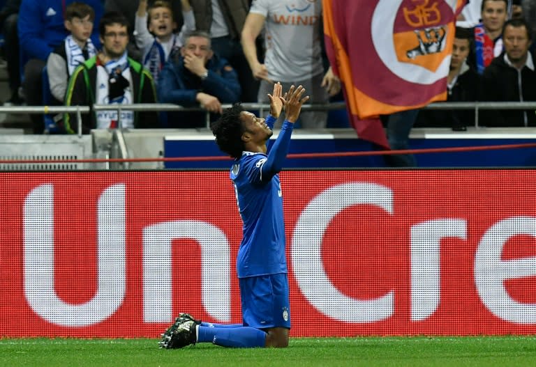 Juventus' Juan Cuadrado celebrates after scoring a goal against Olympique Lyonnais on October 18, 2016 in Decines-Charpieu near Lyon, southeastern France