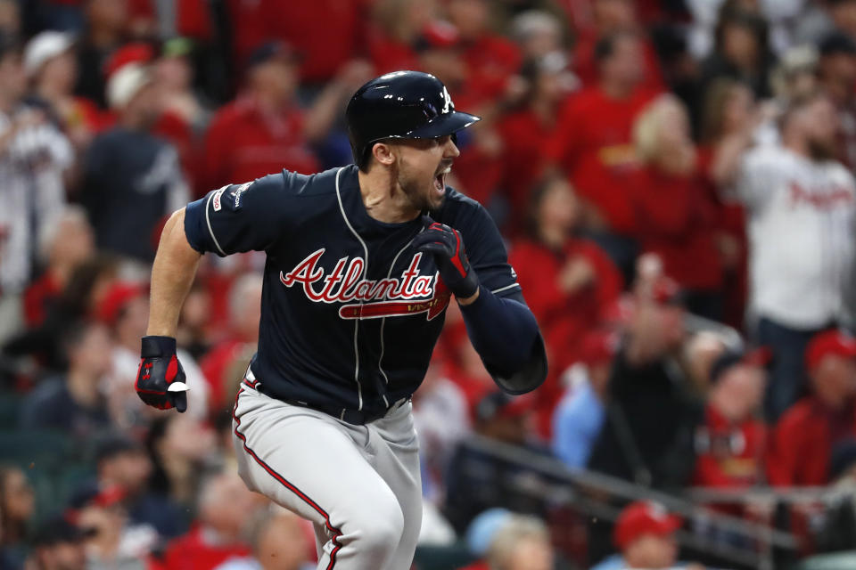 CORRECTS TO SINGLE, INSTEAD OF DOUBLE - Atlanta Braves' Adam Duvall celebrates after hitting a two-run single during the ninth inning in Game 3 of a baseball National League Division Series against the St. Louis Cardinals, Sunday, Oct. 6, 2019, in St. Louis. (AP Photo/Jeff Roberson)