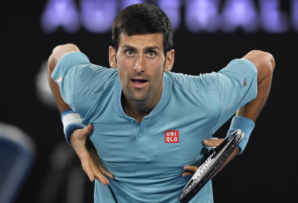 Serbia's Novak Djokovic gestures to his supporters in the crowd after defeating Spain's Fernando Verdasco in their first round match at the Australian Open tennis championships in Melbourne, Australia, Tuesday, Jan. 17, 2017. (AP Photo/Andy Brownbill)