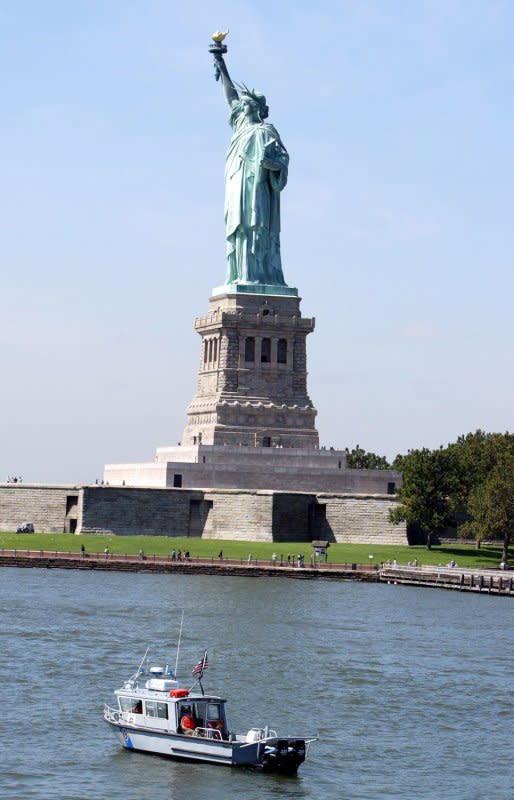 A U.S. Coast Guard boat patrols the waters near the Statue of Liberty on September 2, 2004. On August 3, 2004, the statue was open to visitors for the first time since the Sept. 11, 2001, terror attacks on New York City. File Photo by Bill Greenblatt/UPI