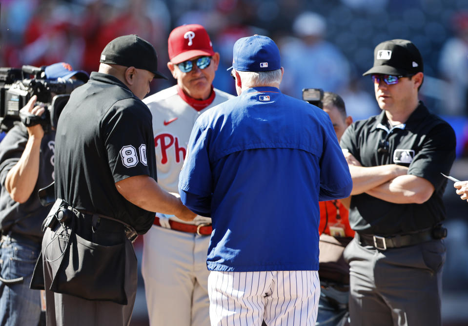 New York Mets manager Buck Showalter does line up exchange before the start of baseball game against the Philadelphia Phillies, Sunday, Oct. 1, 2023, in New York. (AP Photo/Noah K. Murray)