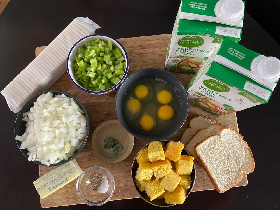 The ingredients for Paula Deen's stuffing laid out on wooden cutting board