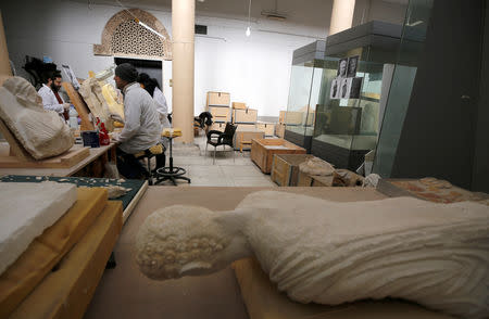 Specialists work on damaged statues from Palmyra at Syria's National Museum of Damascus, Syria January 9, 2019. Picture taken January 9, 2019. REUTERS/Omar Sanadiki