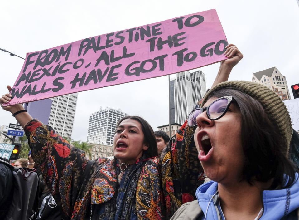 FILE--In this Feb. 18, 2017, file photo, thousands take part in the ''Free the People Immigration March,'' to protest actions taken by President Donald Trump and his administration, in Los Angeles, Calif. Attorney General Jeff Sessions' new guidelines on border crimes suggest prosecutors in California will be forced to tow a narrow line, along with counterparts in Arizona, New Mexico and Texas. (AP Photo/Ringo H.W. Chiu, file)