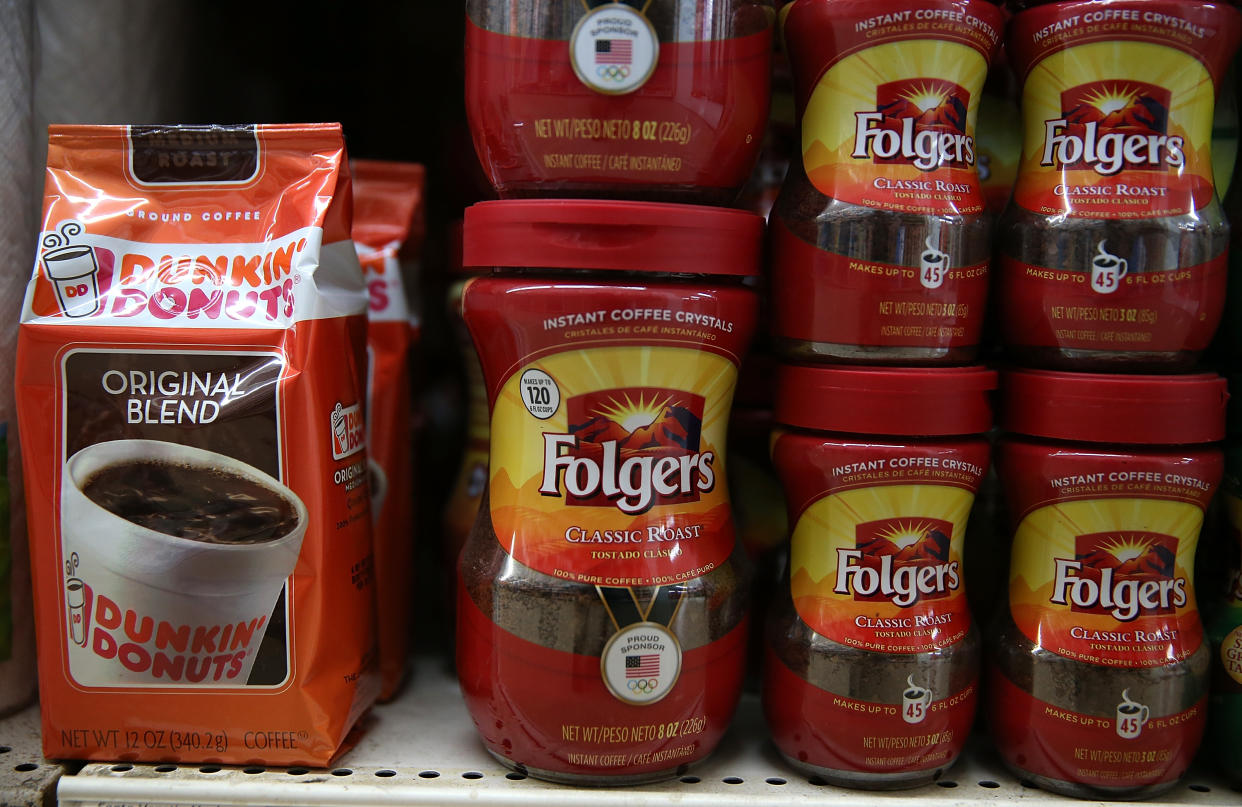 SAN RAFAEL, CA - JUNE 05:  Packages Dunkin' Donuts and Folgers coffee are displayed on a shelf at a grocery store on June 5, 2014 in San Rafael, California.  Ohio-based J.M.Smucker announced that the increase in coffee bean prices due to severe drought in Brazil is prompting them to raise the price of Folgers and Dunkin' Donuts coffee by 9 percent. J.M. Smucker's fourth quarter earnings slipped 9 percent with profits of $118.5 million, or $1.16 a share, compared to$130.3 million, or $1.22 a share, one year ago.  (Photo by Justin Sullivan/Getty Images)
