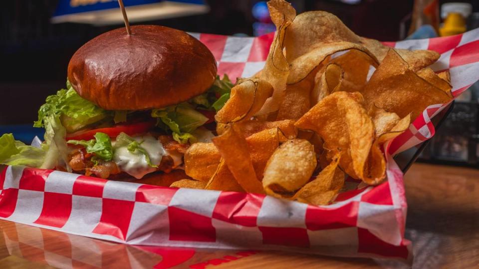 The All-American Burger is one of the food offerings at Jaxx Sports Bar & Grill, 1035 Hasko Road, Palmetto. The restaurant owner plans to expand to a second location with a chicken-focused menu in downtown Bradenton.