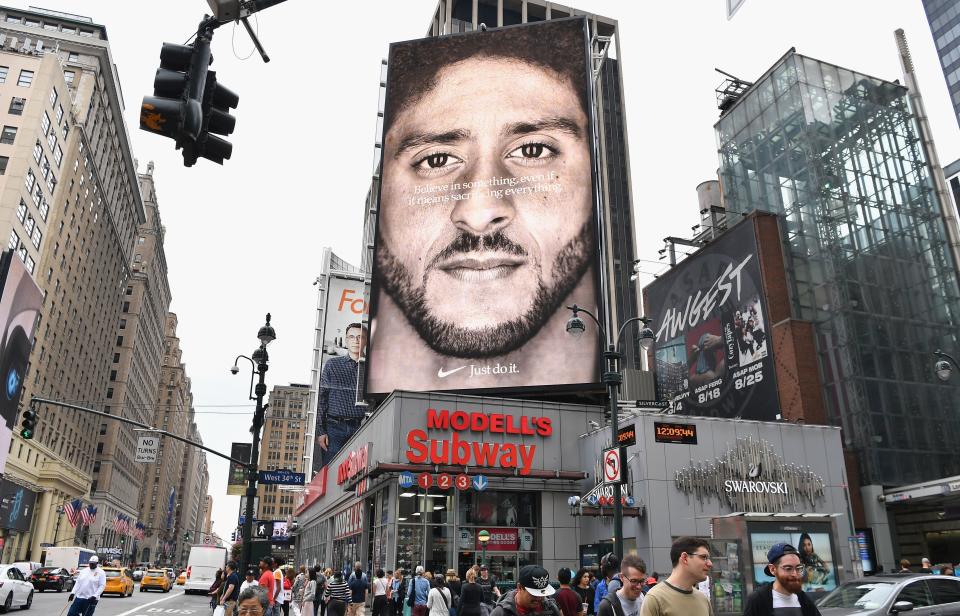 (FILES) In this file photo taken on September 8, 2018 a Nike Ad featuring American football quarterback  Colin Kaepernick is on diplay in New York City. - American millennials -- the generation of people aged 17-35 -- are a popular target for advertisers and brands, but companies risk missing out by approaching them as one homogeneous population. From Gillette razors to McDonald's and American Express, every major American company is touting its efforts to attract these young people, considered the workforce of tomorrow and the new generation of consumers. (Photo by Angela Weiss / AFP)        (Photo credit should read ANGELA WEISS/AFP/Getty Images)
