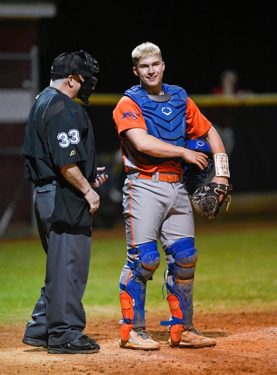 Brooks Brannon chats with an umpire during Randleman's game at Wheatmore on Friday. Brannon has signed a national letter of intent to play at UNC next season.