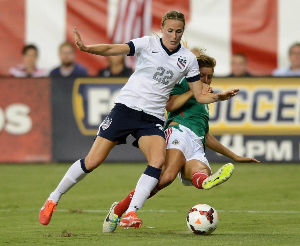 While playing for Mexico in 2013, Sofia Huerta, right, battles with U.S. defender Leigh Ann Robinson for the ball during a friendly in Washington, D.C. Huerta was the first woman to ever play for and against the U.S. women’s senior national team.