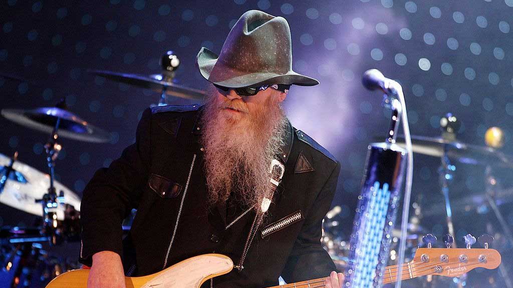  Dusty Hill playing a Fender Precision bass guitar. 