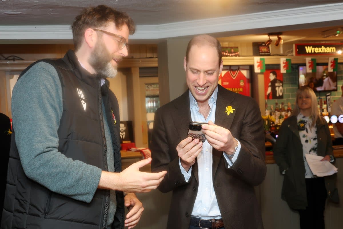 Prince William meets Humphrey Ker during a visit to The Turf public house at Wrexham (PA)