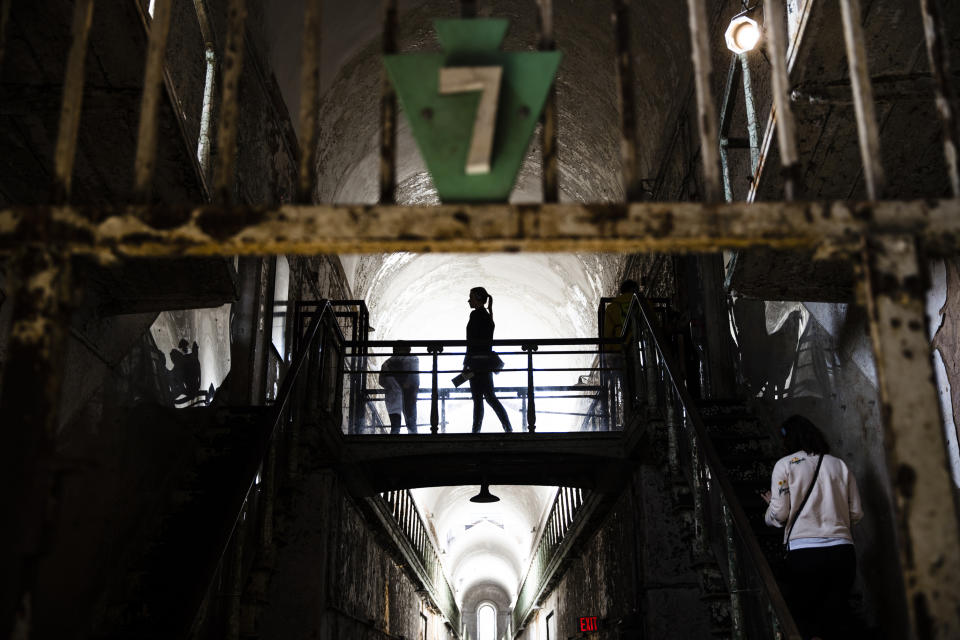 Tourist visit cellblock 7 of the Eastern State Penitentiary, Thursday, May 2, 2019, which is now a museum in Philadelphia. (AP Photo/Matt Rourke)