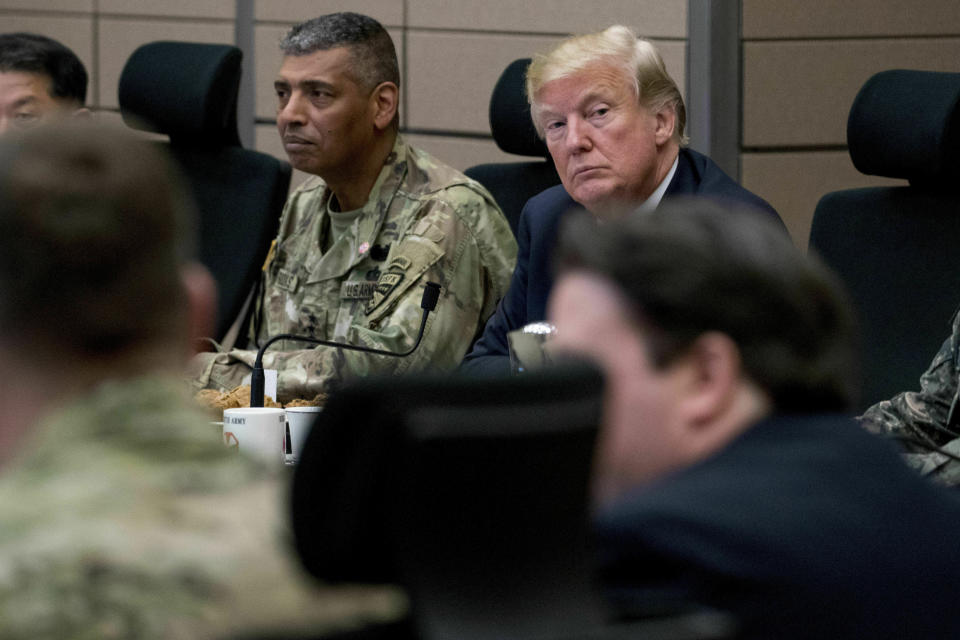 FILE - In this Nov. 7, 2017, file photo, U.S. President Donald Trump, accompanied by United States Forces Korea Commander Gen. Vincent Brooks, center left, attends an operational briefing at the eighth Army Operational Command Center at Camp Humphreys in Pyeongtaek, South Korea. Ahead of the second summit between Trump and North Korean leader Kim Jong Un, some observers say there is an uncertainty over the future of the decades-long military alliance between Washington and Seoul. (AP Photo/Andrew Harnik, File)