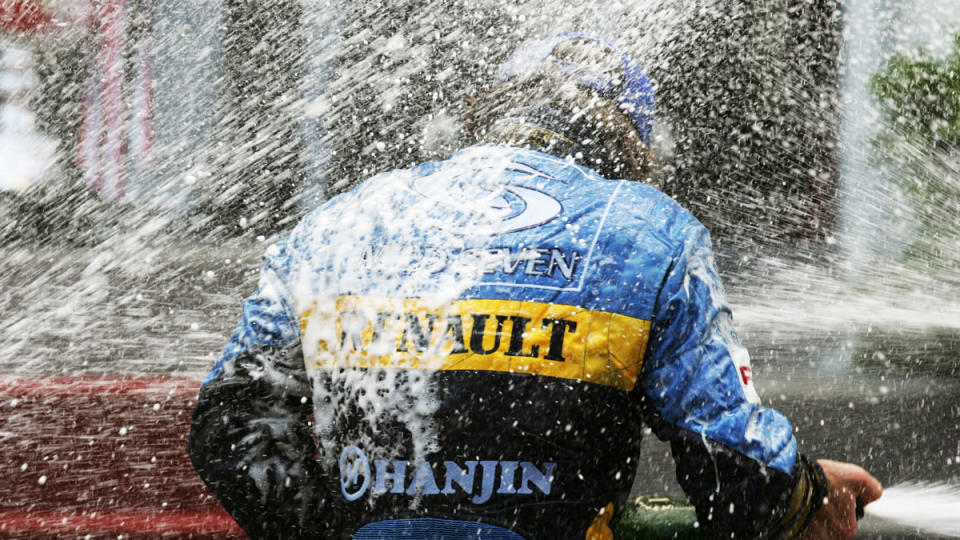 Renault driver Jarno Trulli celebrates his only Formula 1 victory at the 2004 edition of the Monaco Grand Prix.