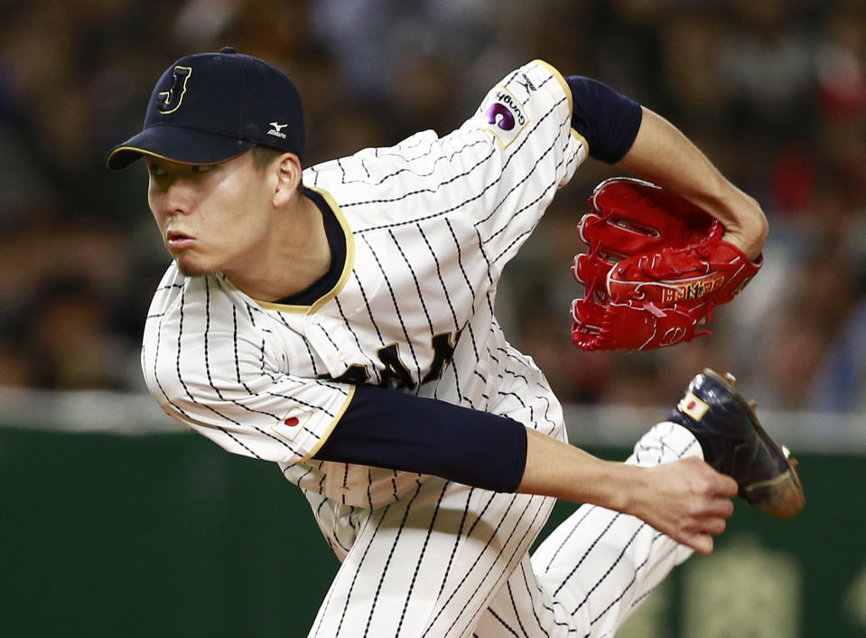 FILE - Japan's starter Kodai Senga pitches against Israel during the first inning of a second-round game at the World Baseball Classic in Tokyo, March 15, 2017. Senga and the New York Mets have agreed to a $75 million, five-year contract, according to a person familiar with the negotiations. The person spoke on condition of anonymity early Sunday, Dec. 11, 2022, because the deal was pending a physical. (AP Photo/Shizuo Kambayashi, File)