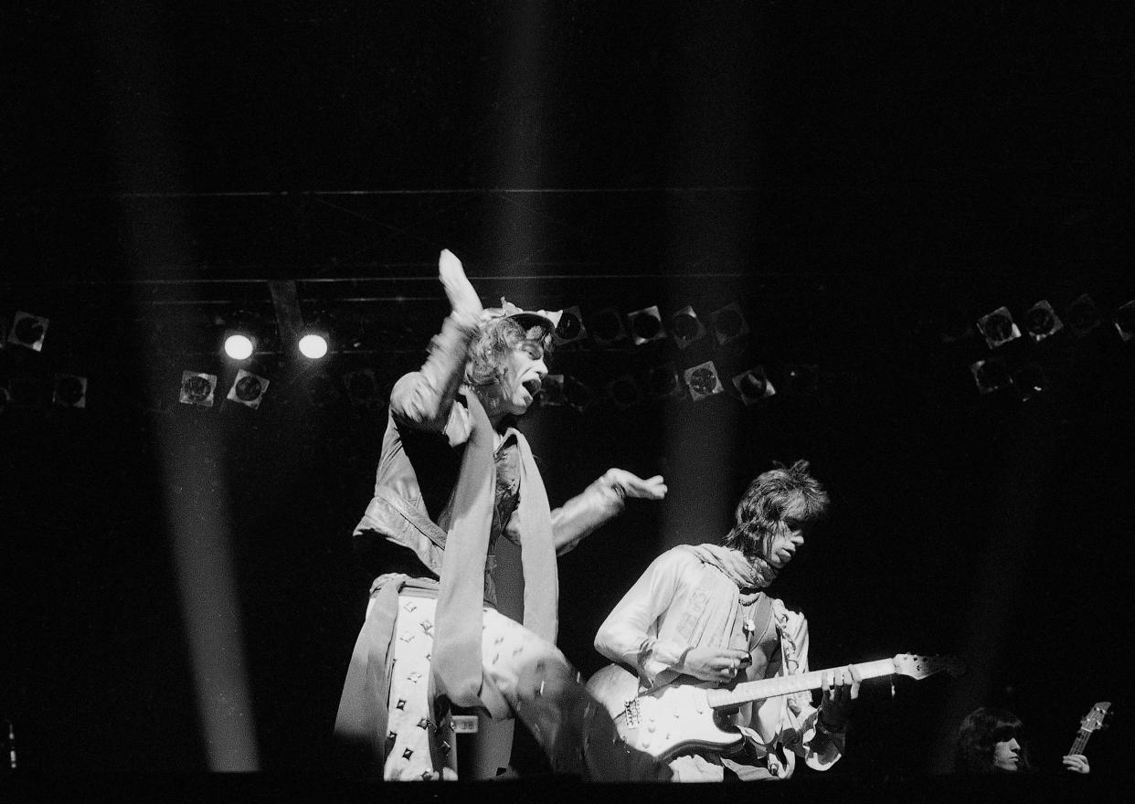 Mick Jagger of the Rolling Stones, left, sings to a crowd of more that 25,000 fans at Madison Square Garden in New York, July 24, 1972, with Keith Richards on lead guitar.