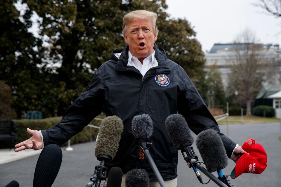 President Donald Trump talks with reporters outside the White House before traveling to Alabama to visit areas affected by the deadly tornadoes, March 8, 2019, in Washington.