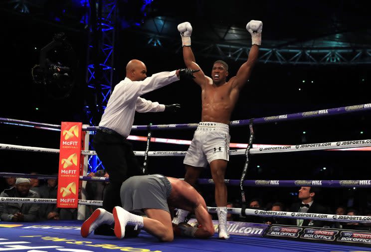 Anthony Joshua celebrates after knocking down Wladimir Klitschko in the 11th round Saturday as referee David Fields sends him to a neutral corner. (Getty Images)