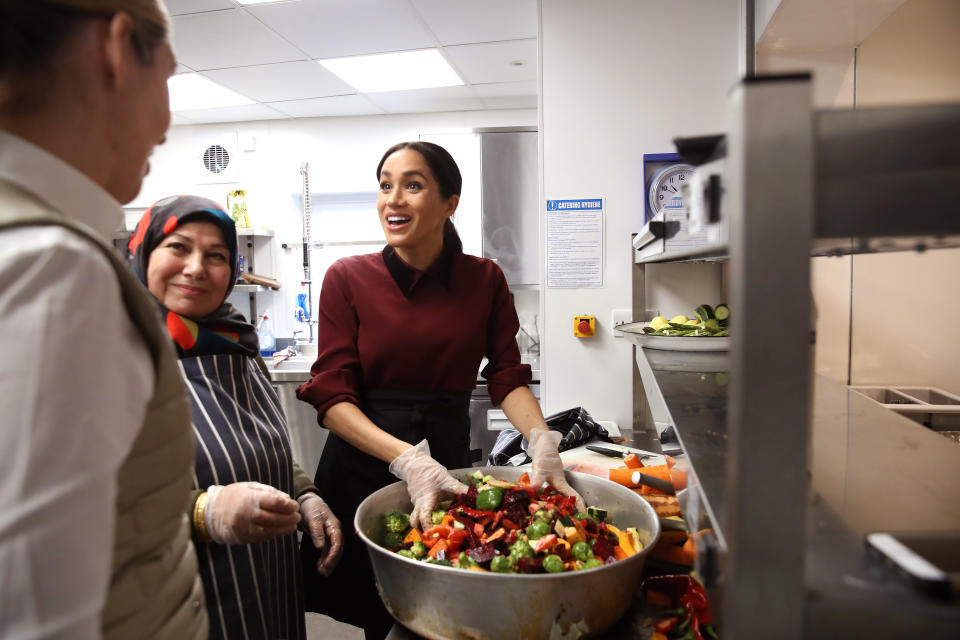 Meghan helps to prepare meals (Getty)