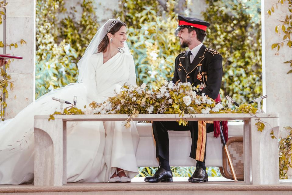 Jordan's Crown Prince Hussein and Rajwa Alseif sit during the wedding ceremony in Amman, Jordan, Thursday, June 1, 2023.