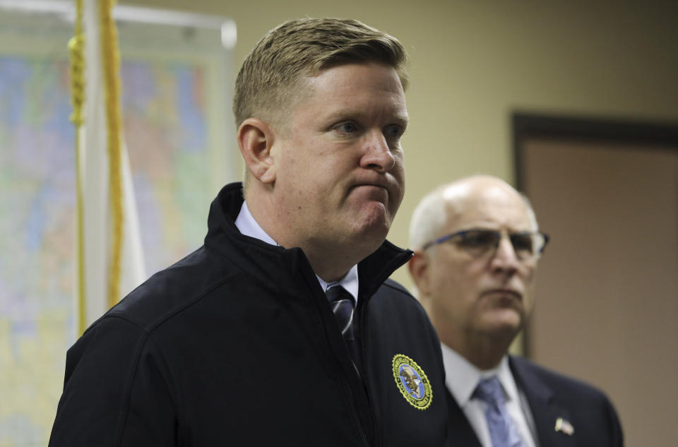 Brendan Kelly Director of Illinois State Police, left, confirms the death of retired state police trooper Gregory Rieves, during a news conference at the DuPage Coroner's office in Wheaton, Ill., Saturday Jan. 25, 2020. A woman fatally shot the retired Illinois State Police trooper and wounded another retired state trooper and an off-duty trooper Friday night before turning the gun on herself at a cigar lounge in the Chicago suburbs, police said. (Abel Uribe/Chicago Tribune via AP)