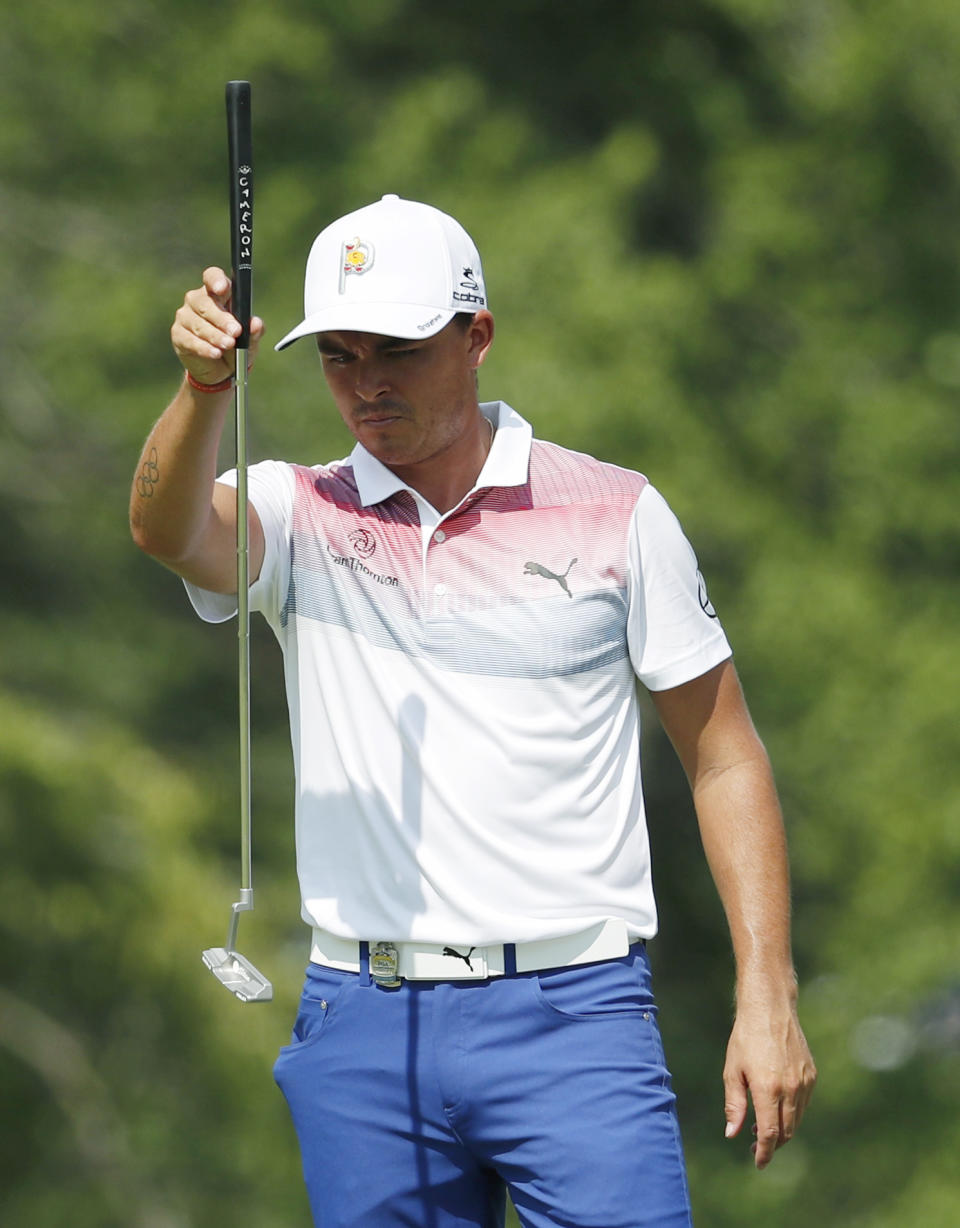 Rickie Fowler lines up a putt on the ninth green during the second round of the PGA Championship golf tournament at Bellerive Country Club, Friday, Aug. 10, 2018, in St. Louis. (AP Photo/Jeff Roberson)