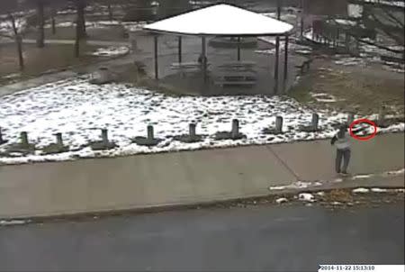 Tamir E. Rice, 12, is seen allegedly pointing a pellet gun at the Cudell Recreation Center in Cleveland, Ohio, in this still image from video released by the Cleveland Police Department November 26, 2014. REUTERS/Cleveland Police Department/Handout via Reuters