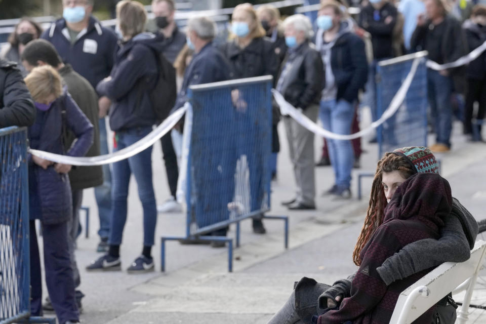 FILE - People wait for COVID-19 vaccination in Zagreb, Thursday, Nov. 4, 2021. Throughout the Central and Eastern Europe, where vaccination rates are much lower than in the rest of the continent, the surprisingly tough wave has ripped through mercilessly during the past two months, hitting record numbers of infections and taking thousands of lives. Amid the surge, the former Communist nations that once carried out nationwide mandatory inoculations without hesitation, and which were quick to impose tough lockdowns at the start of the pandemic, let the virus rage unimpeded for weeks before taking action. (AP Photo/Darko Bandic, File)