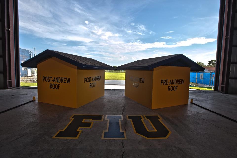 Two small structures await testing at Florida International University's Wall of Wind in Miami. One has a roof that meets post-Hurricane Andrew building codes, while the other roof does not.