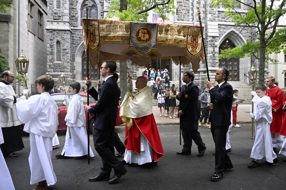 The Eucharistic host is held in a monstrance during a procession outside of St. Mary's Church, Saturday, May 18, 2024, in New Haven, Conn. The Eucharistic Procession from St. Mary's Church is one of four pilgrimage routes crossing the country and converging at the National Eucharistic Congress in Indianapolis, July 16. (AP Photo/Jessica Hill)