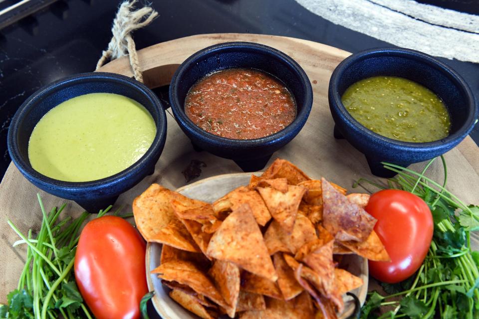 Jalape–o lime, mild and verde salsas made by Salas Salsas sit in dishes on Friday, April 2, 2021 in Sioux Falls. The pair plans to open a food truck soon to expand their business.