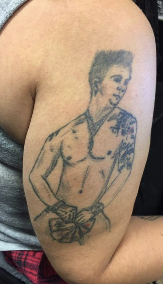 Bad tattoo of Channing Tatum in "Magic Mike," naked while holding cards over his crotch