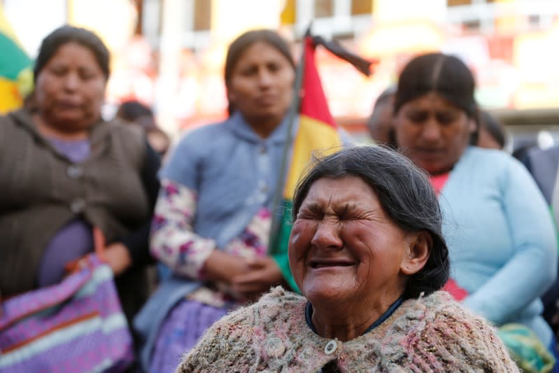 A woman reacts during a rally attended by coca growers from Yungas region and supporters of Luis Fernando Camacho, a Santa Cruz civic leader and major opposition figure, in La Paz