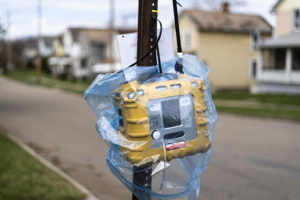 An Environmental Protection Agency (EPA) air monitoring device is mounted to a post following the train derailment in East Palestine, Ohio, Tuesday, April 4, 2023. The EPA's Mark Durno says continual air monitoring at the derailment site and in the community and soil tests in parks, on agricultural land and at other potentially affected areas have not yet detected concerning levels of any contaminants. (AP Photo/Matt Rourke)
