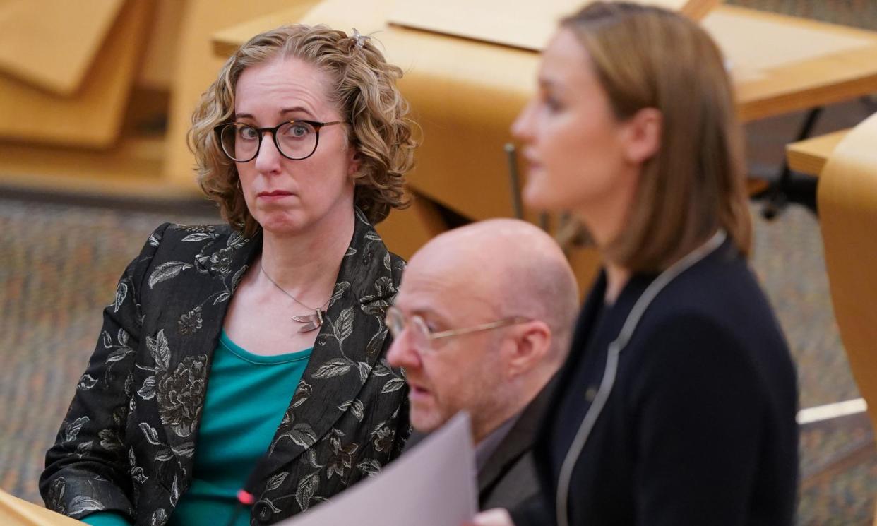 <span>Scottish Green party co-leaders Patrick Harvie and Lorna Slater listen to net zero secretary, Màiri McAllan, right, on 18 April as she announces scrapping of 75% carbon cut pledge.</span><span>Photograph: Andrew Milligan/PA</span>