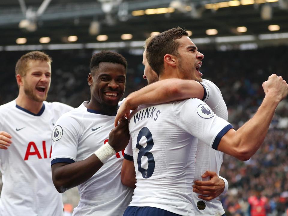 Tottenham players celebrate their third goal of the game: Getty