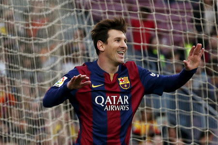 Barcelona's Lionel Messi celebrates his goal against Getafe during their Spanish first division soccer match at Nou Camp stadium in Barcelona, Spain, April 28, 2015. REUTERS/Gustau Nacarino