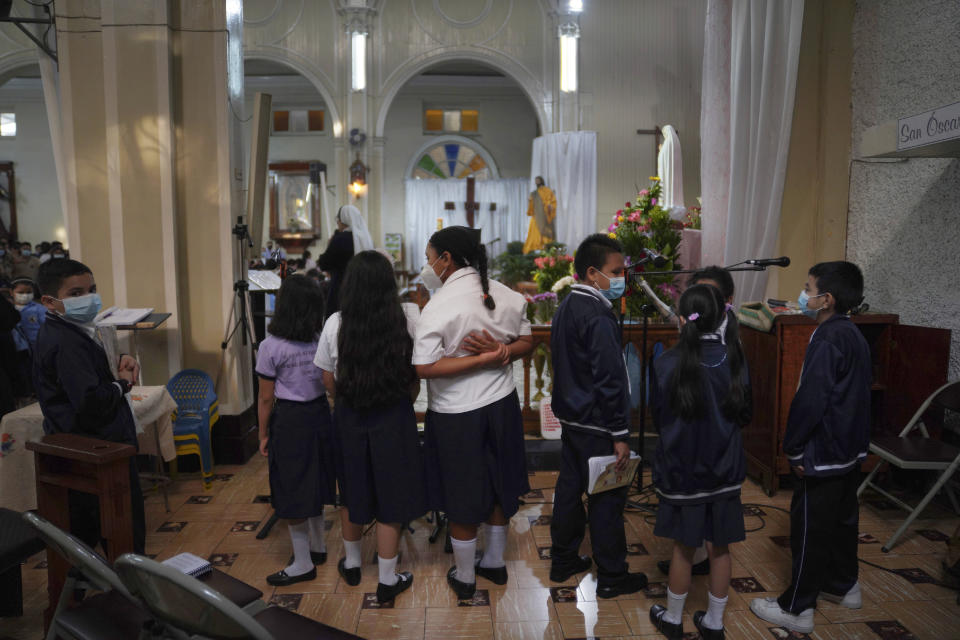 Children sing during morning Mass at San Salvador’s St. Francis of Assisi Parish, on Tuesday, May 17, 2022, in San Salvador, El Salvador. The Catholic Church and a growing number of evangelical churches have vast influence in the overwhelmingly Christian country. (AP Photo/Jessie Wardarski)