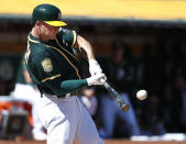 Oakland Athletics' Matt Chapman hits a double to drive in two runs against the Oakland Athletics during the third inning in a baseball game in Oakland, Calif., Thursday, Sept. 20, 2018. (AP Photo/Tony Avelar)