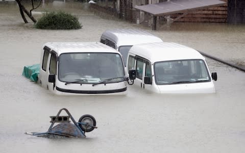 There are fears for low-lying coastal areas, with residents warned they should move to higher ground inland - Credit: Kyodo News/AP