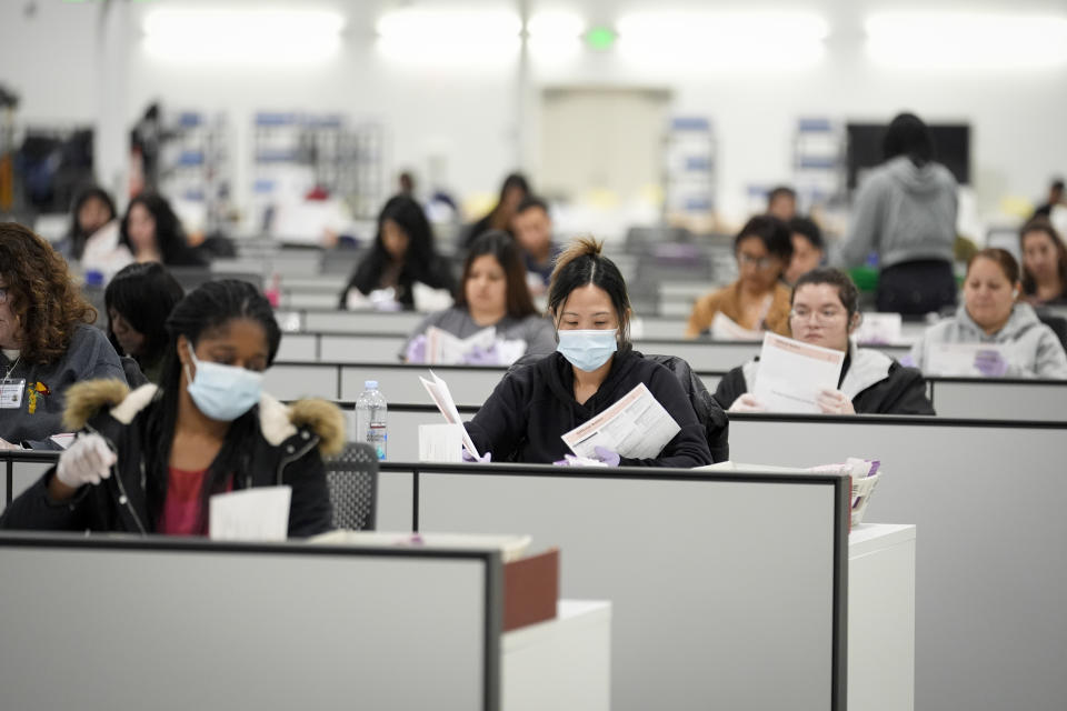 Ballots are inspected at a ballot processing center Tuesday, March 5, 2024, in the City of Industry, Calif. (AP Photo/Marcio Jose Sanchez)