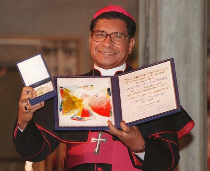 FILE - Nobel Peace Prize laureate, East Timor bishop Carlos Filipe Ximenes Belo displays his certificate and medal during the Nobel ceremony at the Oslo townhall, on Dec. 10, 1996. Belo has been accused in a Dutch magazine article of sexually abusing boys in East Timor in the 1990s, rocking the Catholic Church in the impoverished nation and forcing officials at the Vatican and his religious order to scramble to provide answers. (AP Photo/Bjoern Sigurdsoen, File)