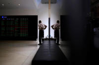 <p>An investor is reflected in a window as he looks at boards displaying stock prices at the Australian Securities Exchange (ASX) in Sydney, Australia, Sept. 30, 2016. (Photo: Steven Saphore/Reuters)</p>