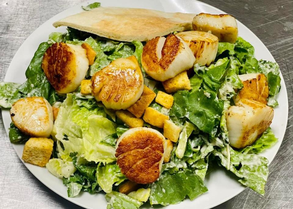 This Caesar salad with scallops is available for lunch and dinner seven days a week at Doyle's Pub & Grill, 956 Washington St., Easton.