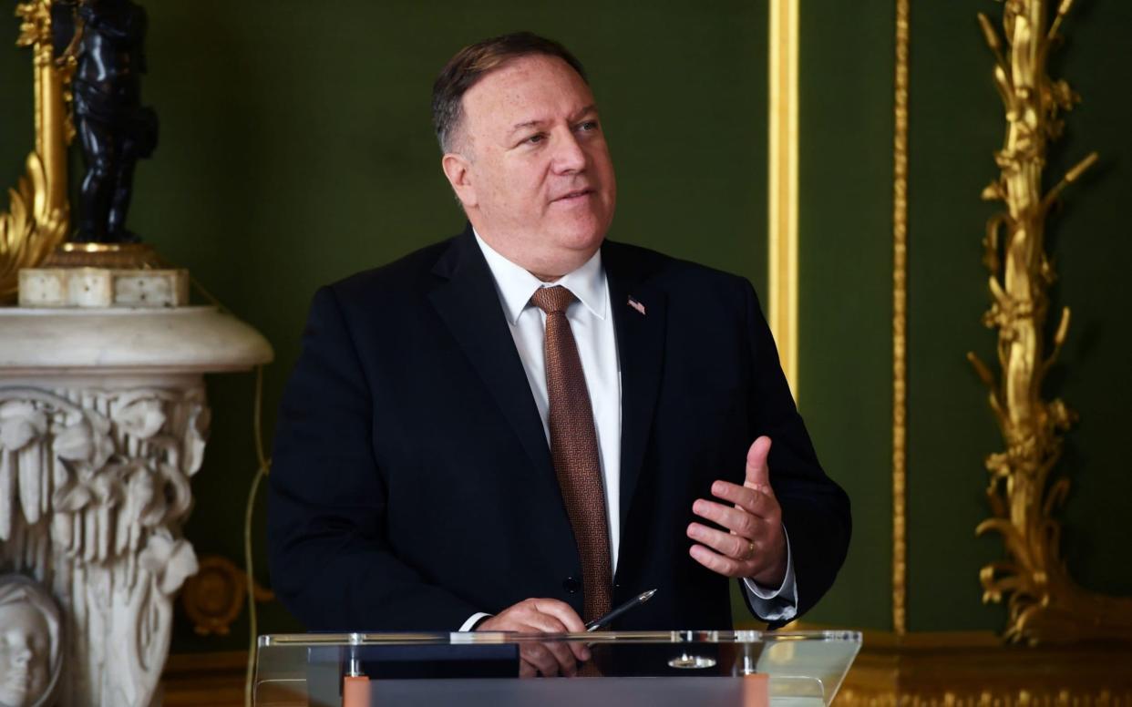 Mike Pompeo told 'China hawks' group of MPs that he doubted the ability of international organisations to rein in Beijing - PA