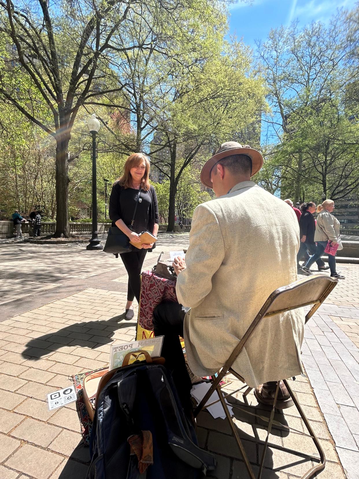 Marshall Kavanaugh types a poem for Michelle Chapman, who wanted a unique gift for her teenage son's birthday.