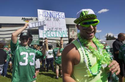 Saskatchewan Roughriders fans cheer before their Labour Day game against the Winnipeg Blue Bombers. (Reuters)