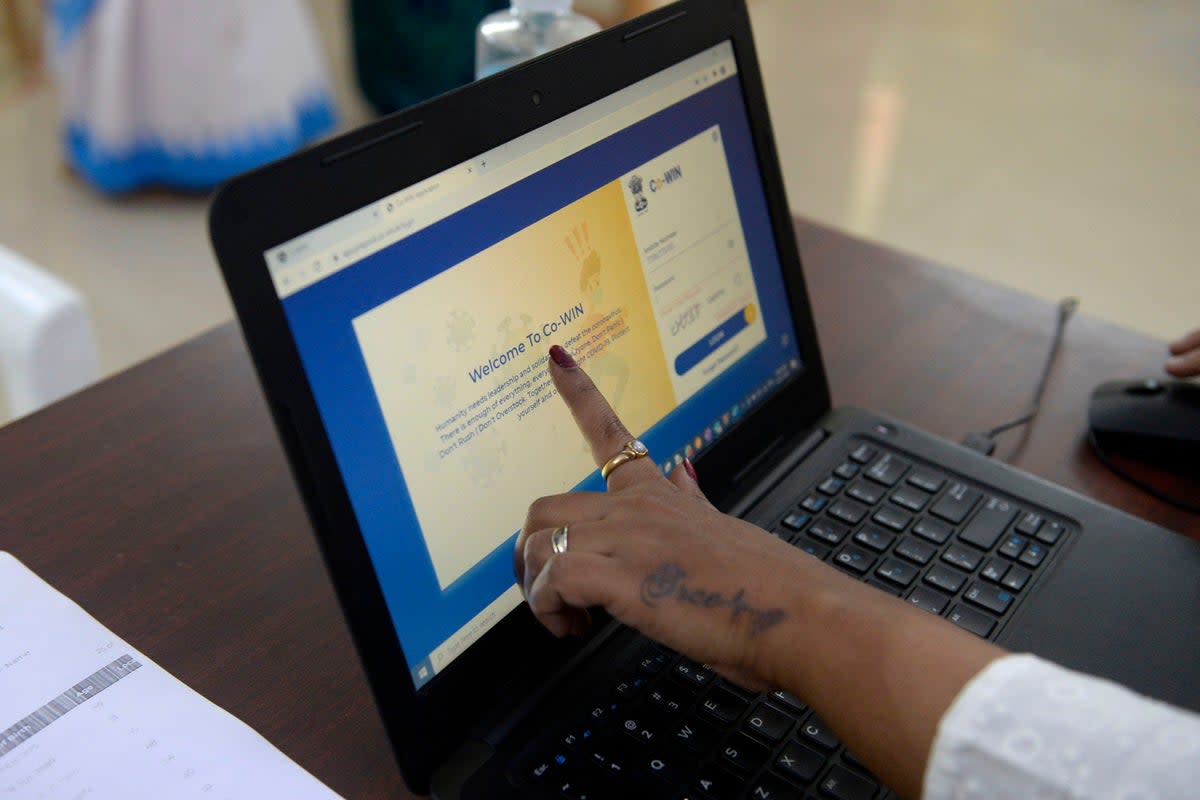 File: A health official shows a CoWIN app to test beneficiaries as she takes part in dry run or a mock drill for Covid-19 coronavirus vaccine delivery (AFP via Getty Images)