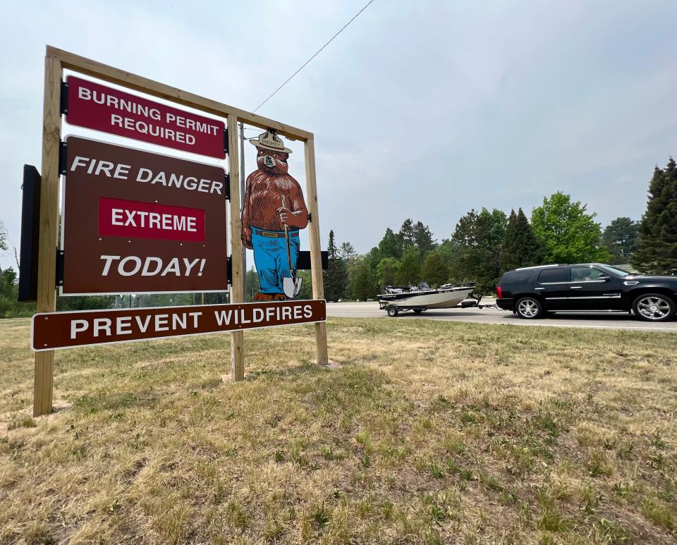 Hot temperatures, sunshine and virtually no rain have fire danger signs ranked at "extreme" throughout the upper half of Michigan's Lower Peninsula and in the Upper Peninsula like this sign near Seney east of Munising.