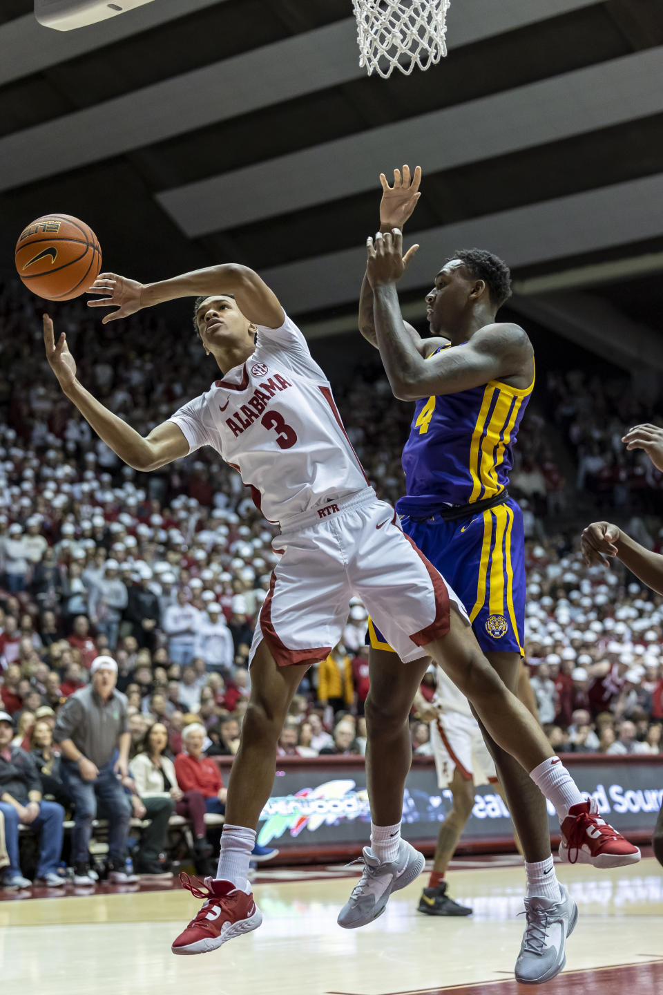 Alabama guard Rylan Griffen (3) chases a rebound with LSU center Kendal Coleman (4) defending during the second half of an NCAA college basketball game, Saturday, Jan. 14, 2023, in Tuscaloosa, Ala. (AP Photo/Vasha Hunt)